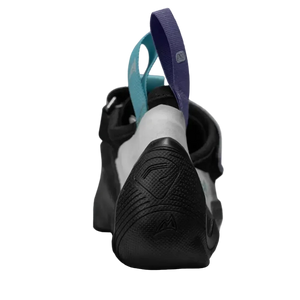 Black climbing shoe with colorful straps on a light gray background