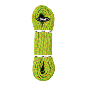 A coiled climbing rope in a bright neon yellow-green color with red and blue twisted flecks, secured with white bands featuring the 'BEAL' brand logo.