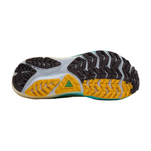 Close-up of a shoe sole with yellow and black pattern on a white background
