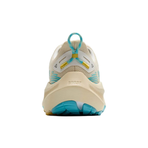Back view of a running shoe with beige and blue design on a white background
