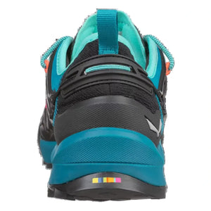A close-up rear view of Salewa women's approach shoe in black and teal, showing the heel counter, laces, and midsole.
