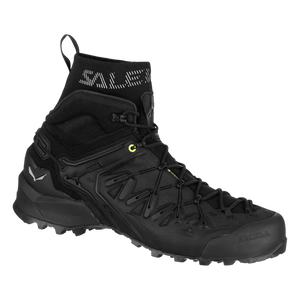 A salewa wildfire mid hiking boot shown from the side on a plain white background. The boot features black laces, a black rubber toe cap, and small bright yellow accents near the lace loops.